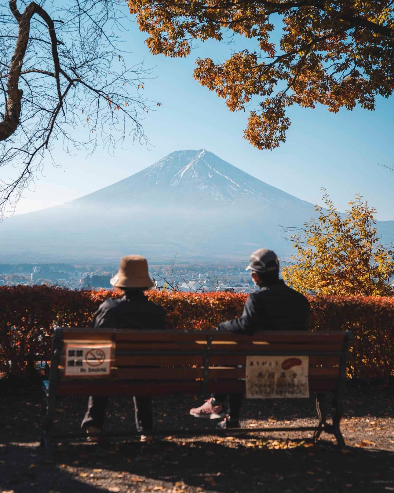 Couple Sitting on a Bench and Looking at Mount Fuji 
