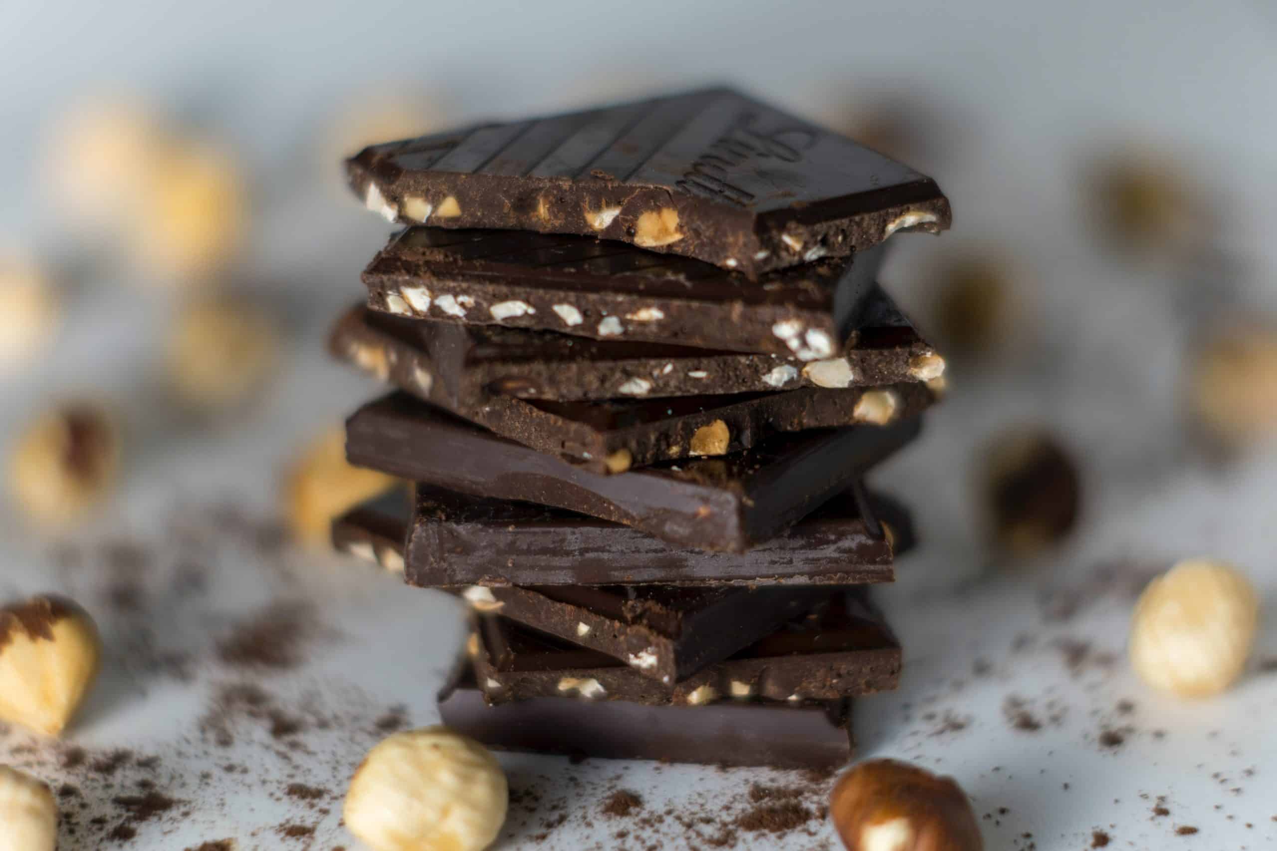 stack of dark chocolate with nuts