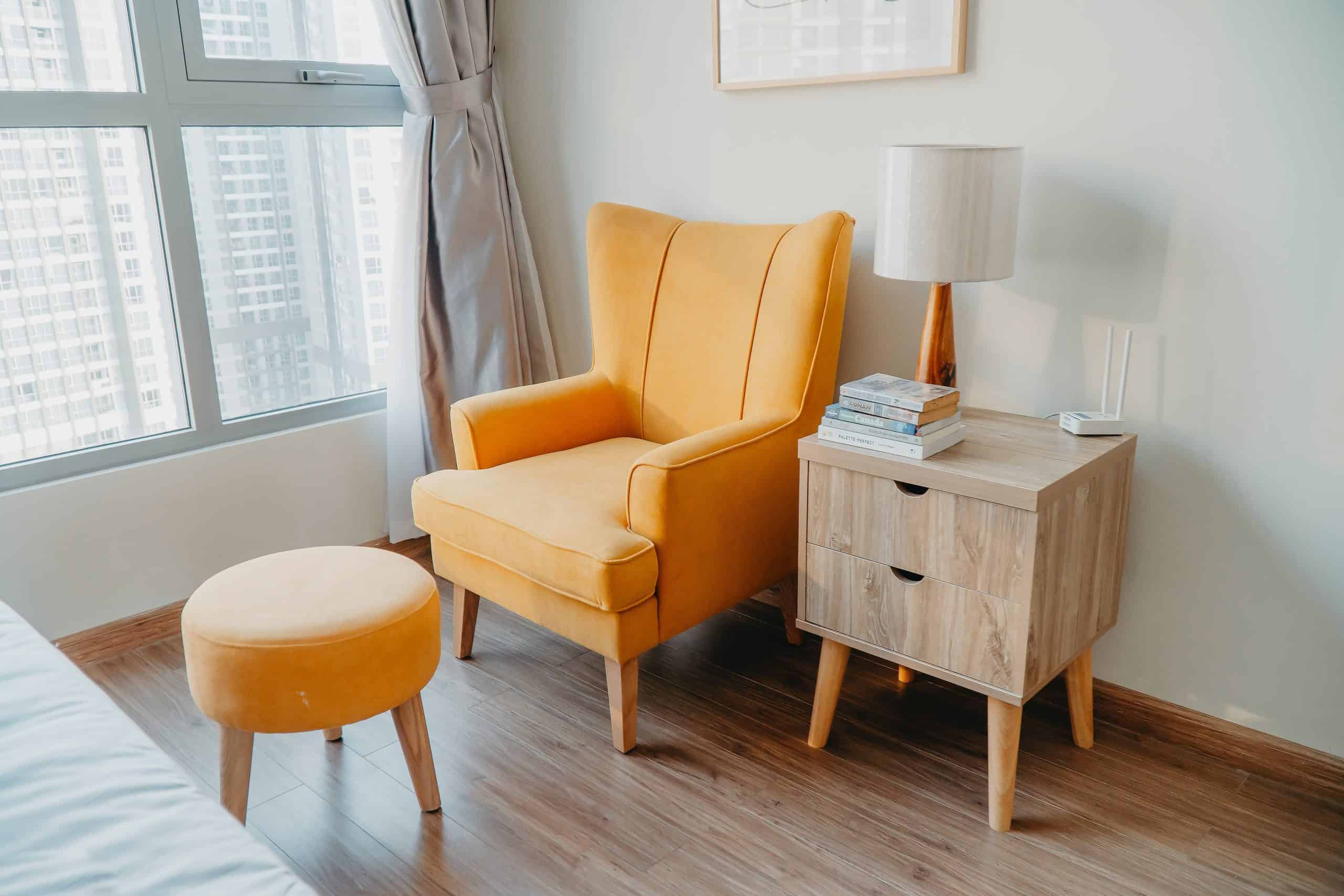 couch and ottoman and side table in a home