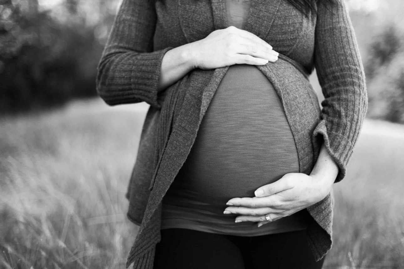 pregnant lady holding her belly