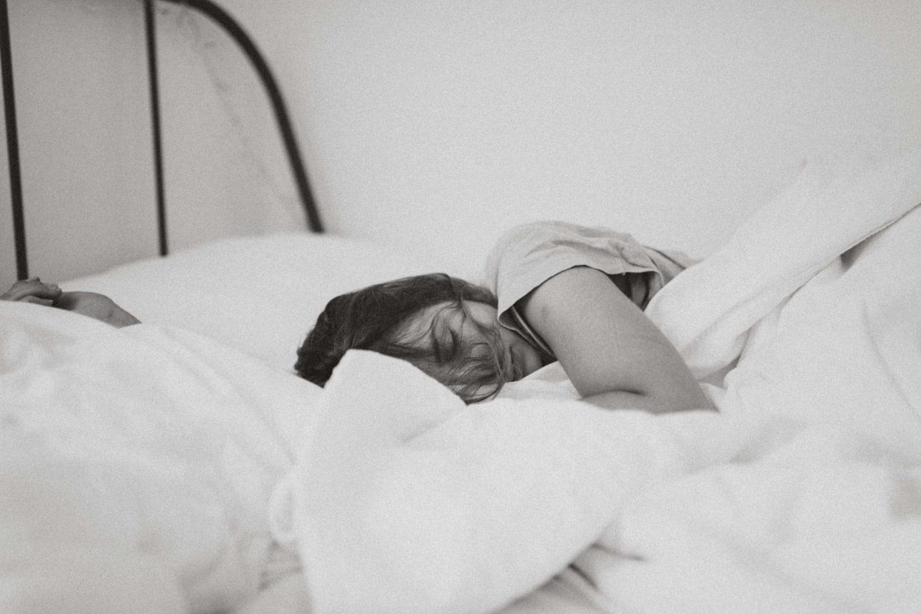 young woman in bed